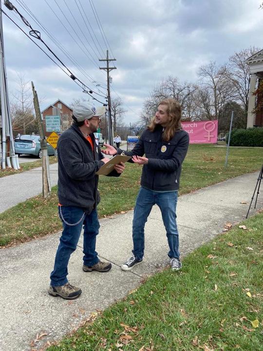 Michael Harrington speakers with a fellow Madison County tenant.