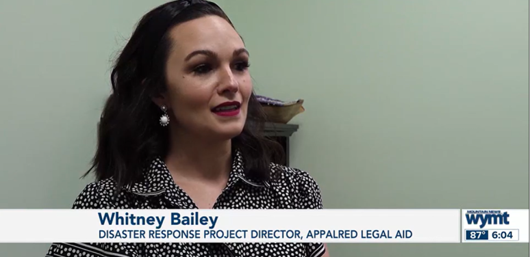 Female attorney in black blouse speaks