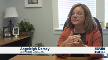 Angie talks from her desk