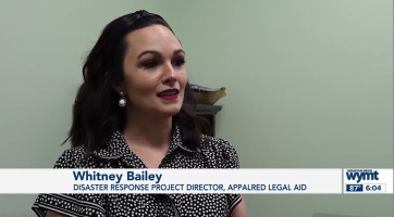 Female attorney in black blouse speaks